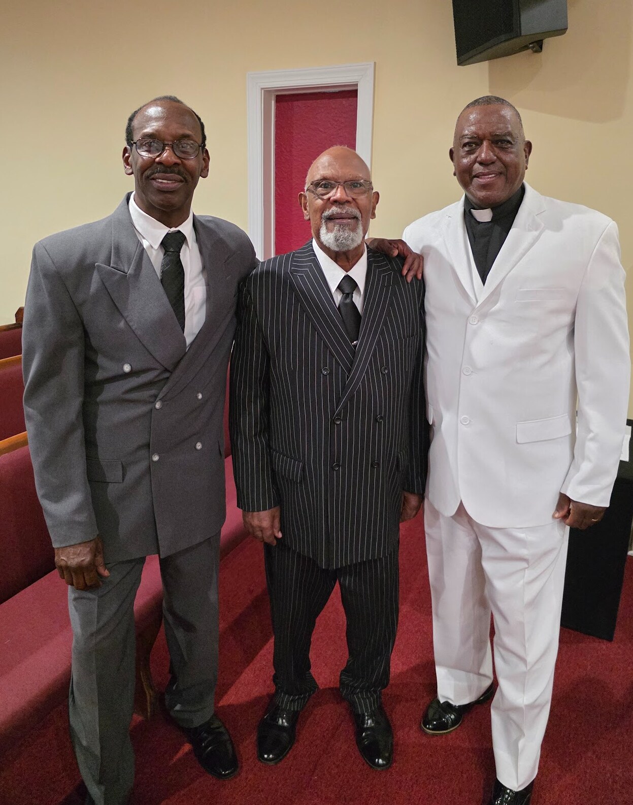 Deacon Lamont Judge and Deacon Robert Wilkins pictured with Pastor Gary Moore