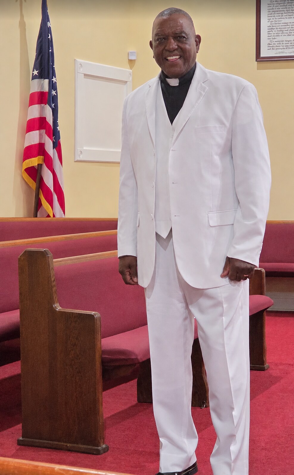 Pastor Gary L. Moore standing in the Daisy Chapel sanctuary